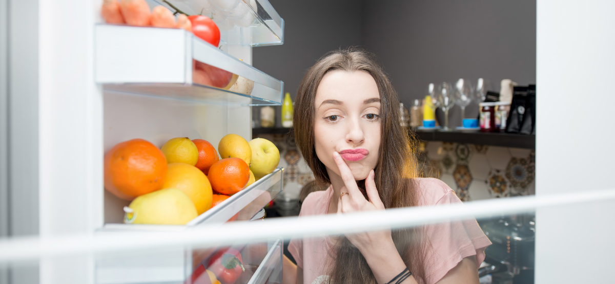 Girl Looking Inside Her Refrigerator