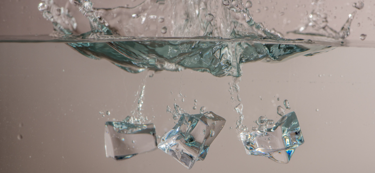 Ice cubes dropped in water