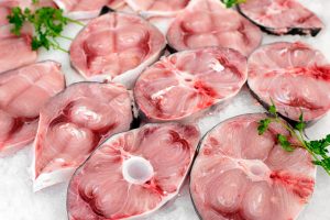 slices of fresh swordfish on a bed of crushed ice